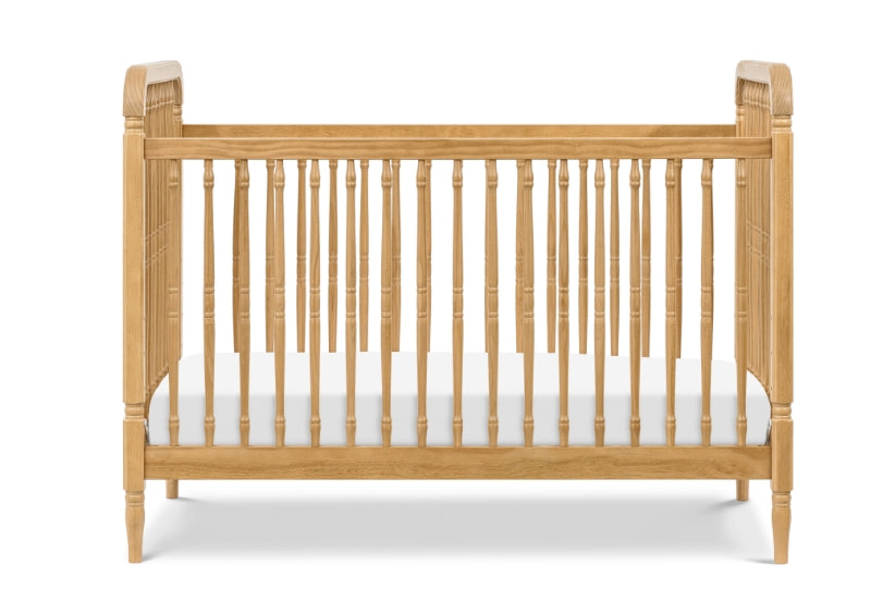 Classic wooden crib with intricate spindle design and curved headboards, isolated on a white background.