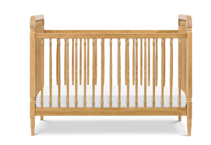 Classic wooden crib with intricate spindle design and curved headboards, isolated on a white background.