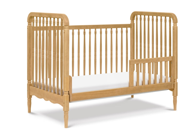 Wooden baby crib with vertical slats and curved edges on a white background.