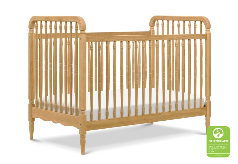 Classic wooden crib with spindle rails and curved headboards, certified by GREENGUARD Gold for low chemical emissions.