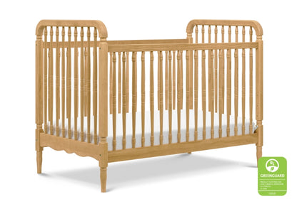 Classic wooden crib with spindle rails and curved headboards, certified by GREENGUARD Gold for low chemical emissions.