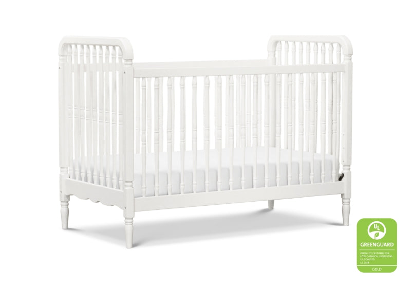 White classic-style baby crib displaying a GREENGUARD Gold certification logo.