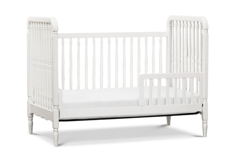 White classic-style crib with detailed railings and legs on a plain background.