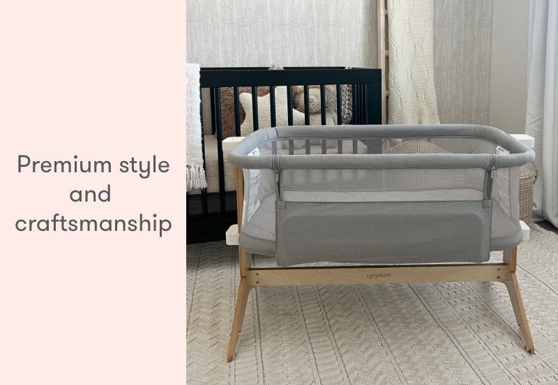ALT text: "A modern gray baby bassinet with wooden legs placed in a serene room, featuring the text 'Premium style and craftsmanship' on the left."