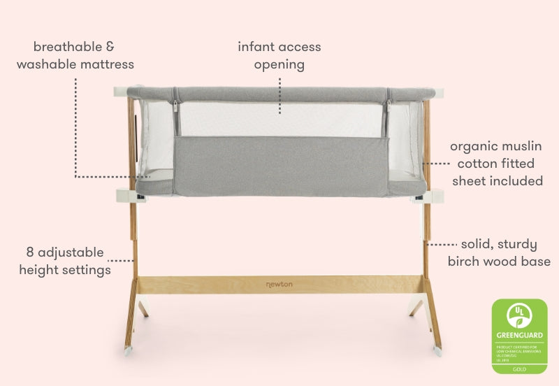 Image of a gray Newton baby bassinet featuring a breathable and washable mattress, infant access opening, organic muslin cotton fitted sheet, sturdy birch wood base, and 8 adjustable height settings.