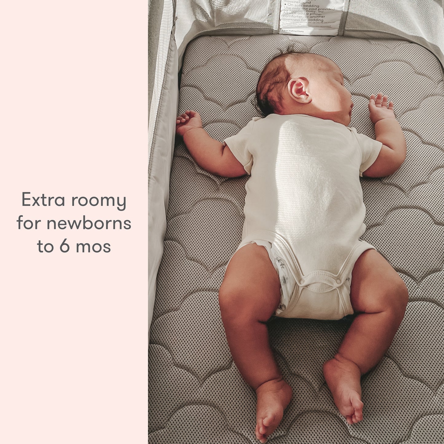 Baby in a grey sleep suit lying on a breathable crib mattress, text reads "Extra roomy for newborns to 6 mos."