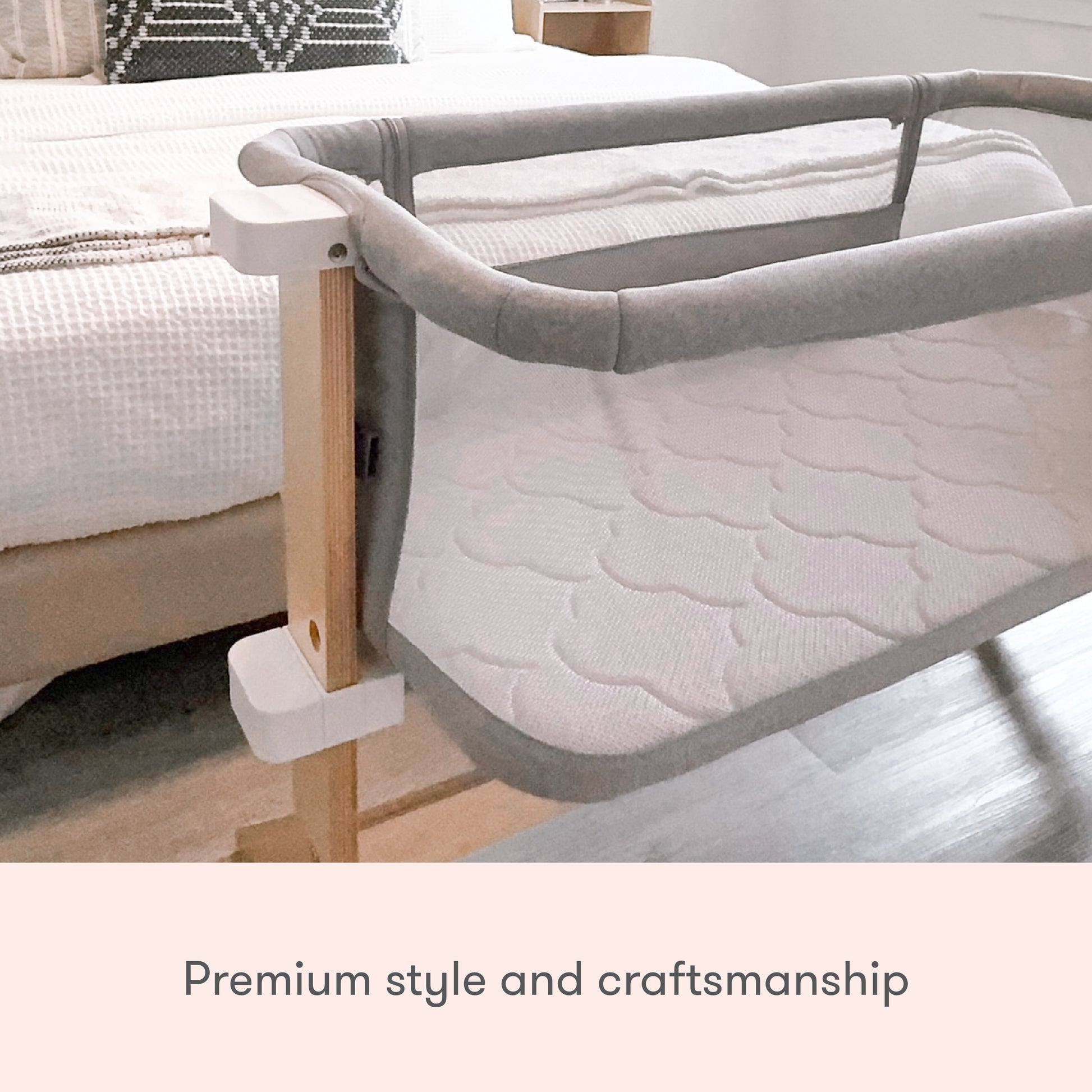 The Newton Baby Bassinet & Bedside Sleeper features modern wooden legs and soft, quilted fabric. Shown beside a neatly made bed in a stylish bedroom. Text: Premium style and craftsmanship.