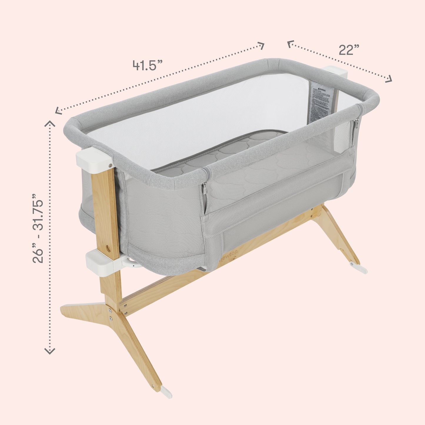 The Newton Baby Bundle 3 BFCM bassinet features a gray and white design with breathable mesh sides, wooden legs, and adjustable height from 26 to 31.75 inches. Dimensions: 41.5” L x 22” W.
