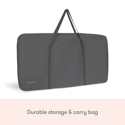 A dark gray rectangular storage and carry bag with handles, featuring "newton" in light blue on the lower left corner. Ideal for transporting your Newton Baby Bassinet & Bedside Sleeper. Text below: Durable storage & carry bag.