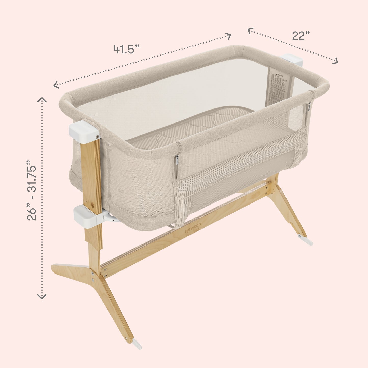 The Newton Baby Bassinet & Bedside Sleeper features breathable mesh sides, wooden legs, and a Wovenaire mattress. Adjustable height from 26"–31.75", it measures 41.5"x22". Cozy for your baby as a bedside sleeper on a light pink background.