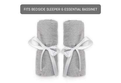 bassinet extra sheets wrapped in ribbons on white background with text, "fits bedside sleeper and essential bassinet"