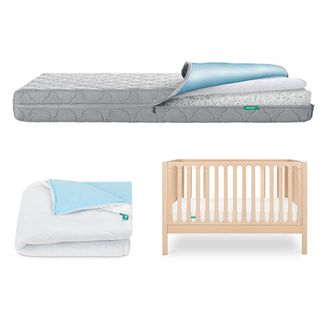 The Newton Baby Galileo Crib, Waterproof Mattress & Pad Set includes a light wooden convertible crib, waterproof mattress with pad, and matching blue and white quilt for a cozy nursery.