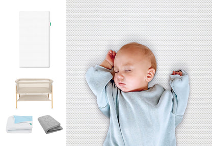 A baby sleeps soundly on a Newton Baby Essential Crib Mattress with Pad, dressed in a light blue sleepsuit. On the left are images of the Essential Bassinet with Extra Cover and additional blankets.