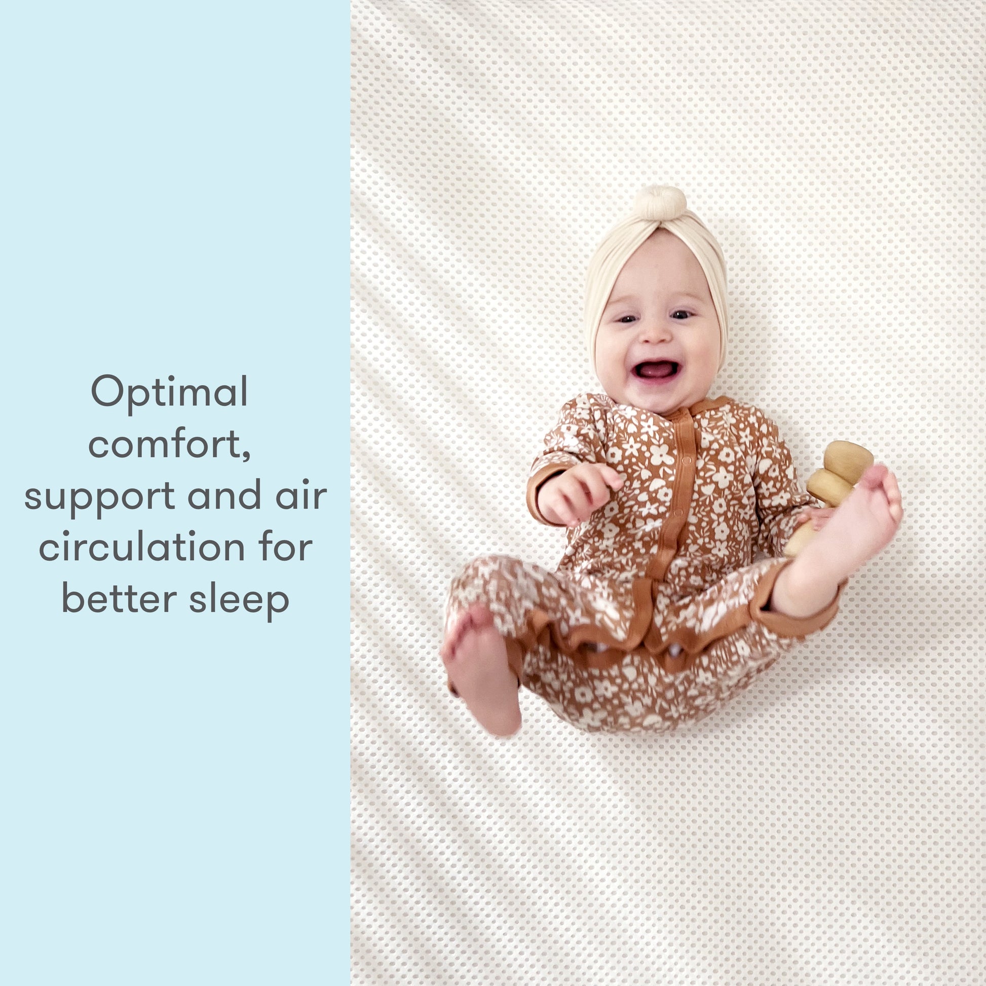 Smiling baby lying on a textured mat wearing a onesie, with text stating 'Optimal comfort, support and air circulation for better sleep'.
