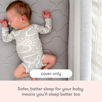 A baby in a light onesie sleeps on the Newton Baby Extra Bassinet Mattress Cover, which is patterned and machine washable. Text reads, "Safer, better sleep for your baby means you’ll sleep better too." A label states, "cover only.