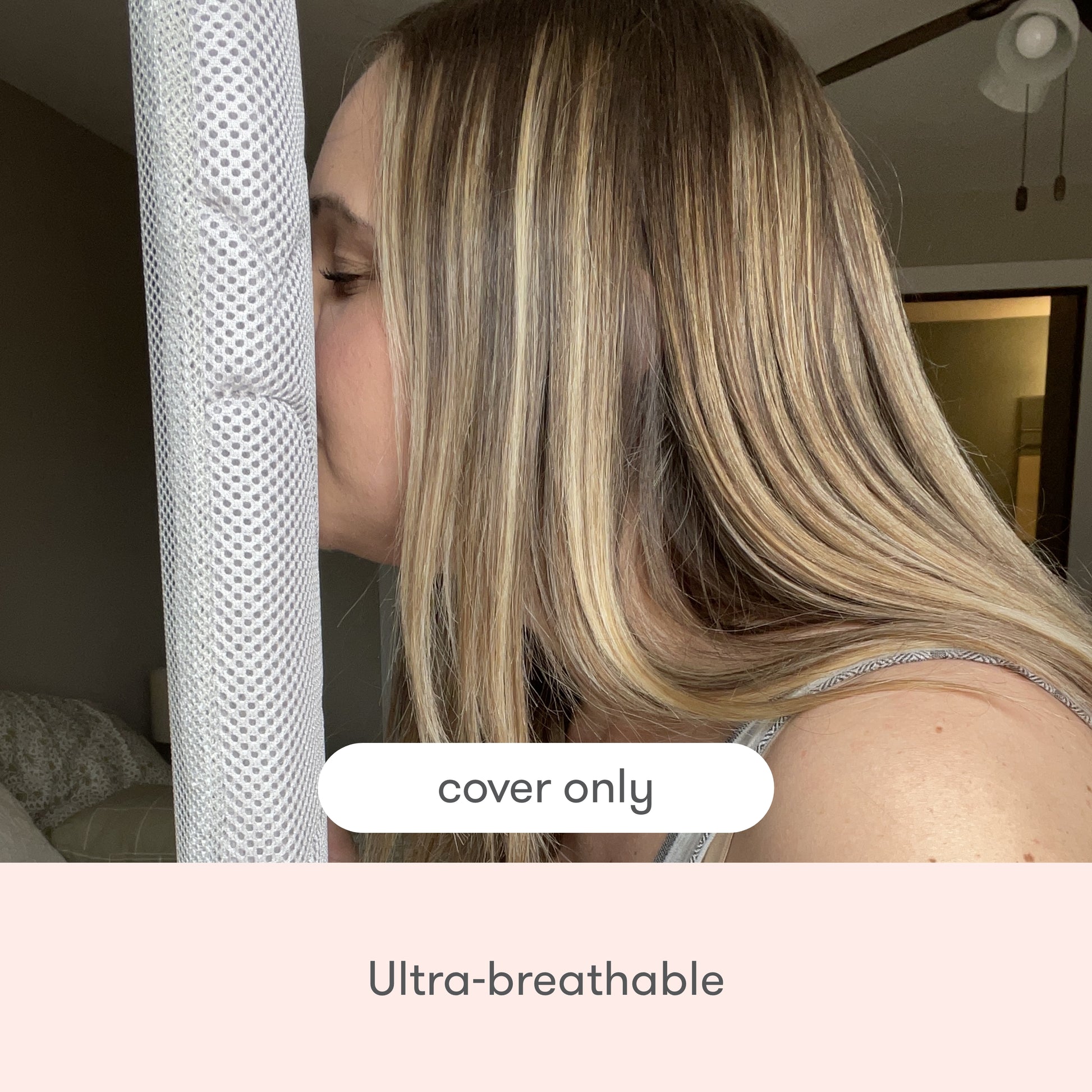 A woman with long blonde hair presses her face to a breathable white mesh marked “cover only” and “Ultra-breathable,” showcasing the quilted, machine-washable Newton Baby Extra Bassinet Mattress Cover.