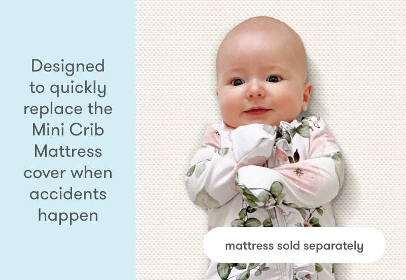 Happy baby wearing a floral outfit lying on a textured background with text saying 'Designed to quickly replace the Mini Crib Mattress cover when accidents happen, mattress sold separately.'