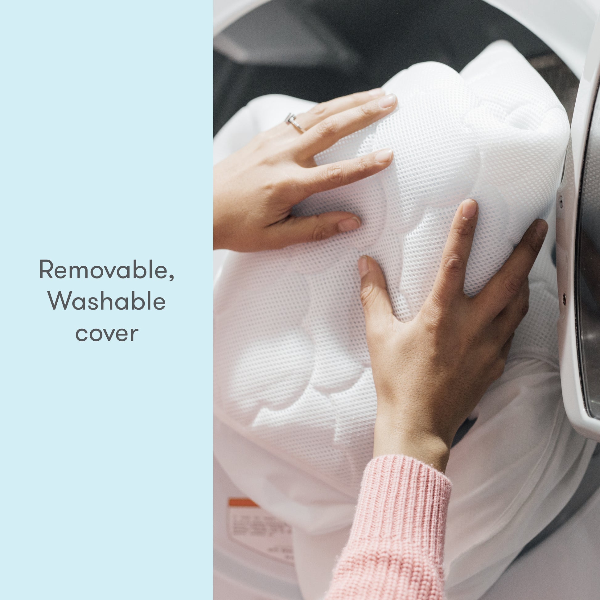 A person puts the Newton Baby Extra Original Crib Mattress Cover into a washing machine. Text reads, "Removable, Washable cover." The cover is white and quilted; the person wears a pink sweater and a ring.