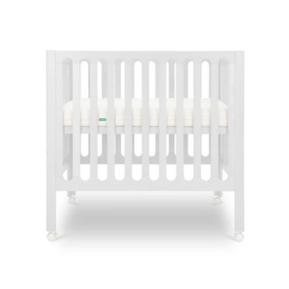 White crib with a white mattress on a white background. 999-8430-WHT