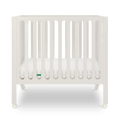Warm White crib with a visible brand logo on a white background 999-8430-
WRW