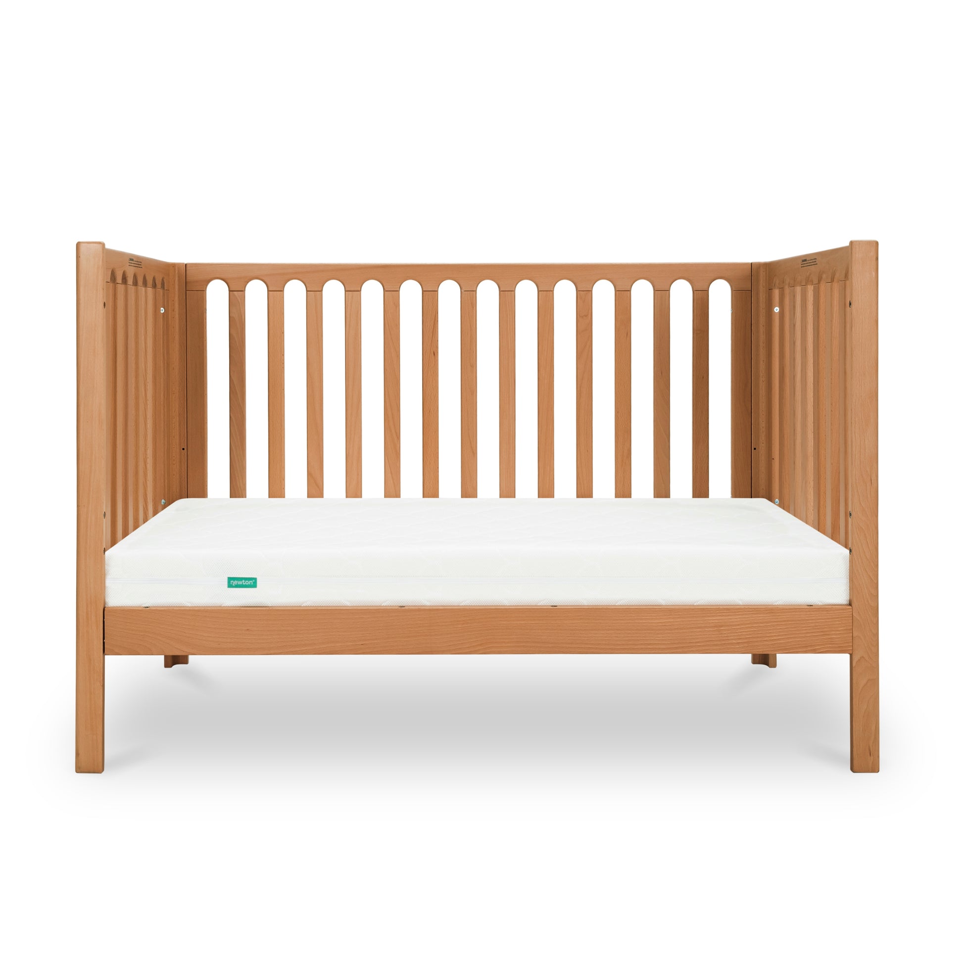 The Newton Galileo Convertible Crib by Newton Baby, made of beech wood with vertical slats and a white mattress, is shown against a plain white background. It easily converts to a toddler bed for long-lasting versatility.