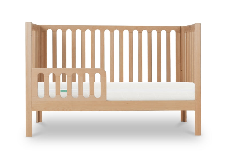 newton galileo crib in natural color converted to toddler mode, with guard, front facing product image with white background.