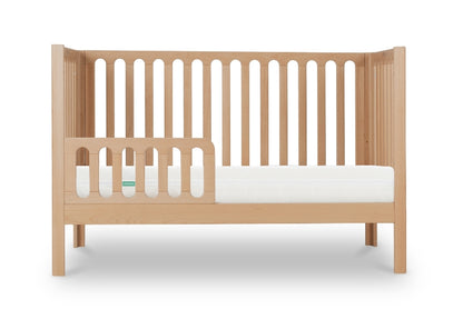 newton galileo crib in natural color converted to toddler mode, with guard, front facing product image with white background.