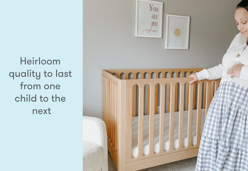 pregnant mom in a nursery standing next to newton galileo crib in natural color, text reads "heirloom quality to last from one child to the next"