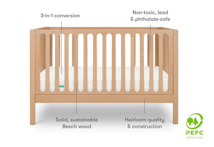newton galileo crib in natural color, diagram with information that reads, "3-in-1 conversion, non-toxic, lead & phthalate-safe, heirloom quality & construction, solid, sustainable beech wood" PEFC certified badge