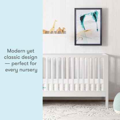 A modern yet classic white crib in a stylish nursery, with text stating "Modern yet classic design — perfect for every nursery."