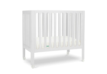 White modern baby crib with a thin mattress on wheels. 999-8430-WHT
