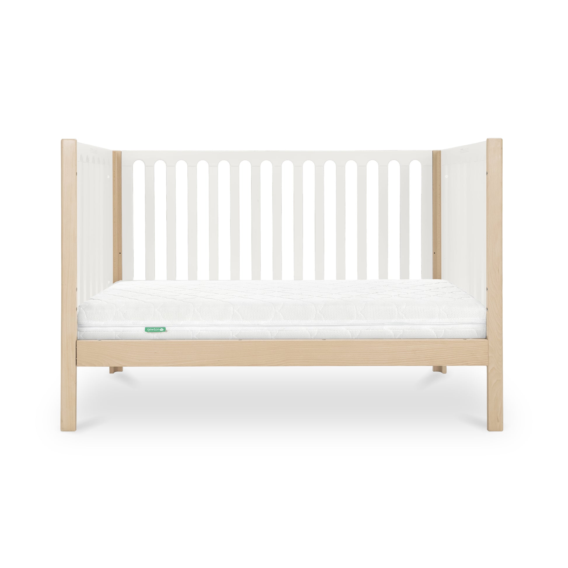 The Newton Baby Newton Galileo Convertible Crib features light beech wood legs and frame, white slatted sides, a white mattress, and offers toddler bed conversion for long-term use. Shown against a plain white background.