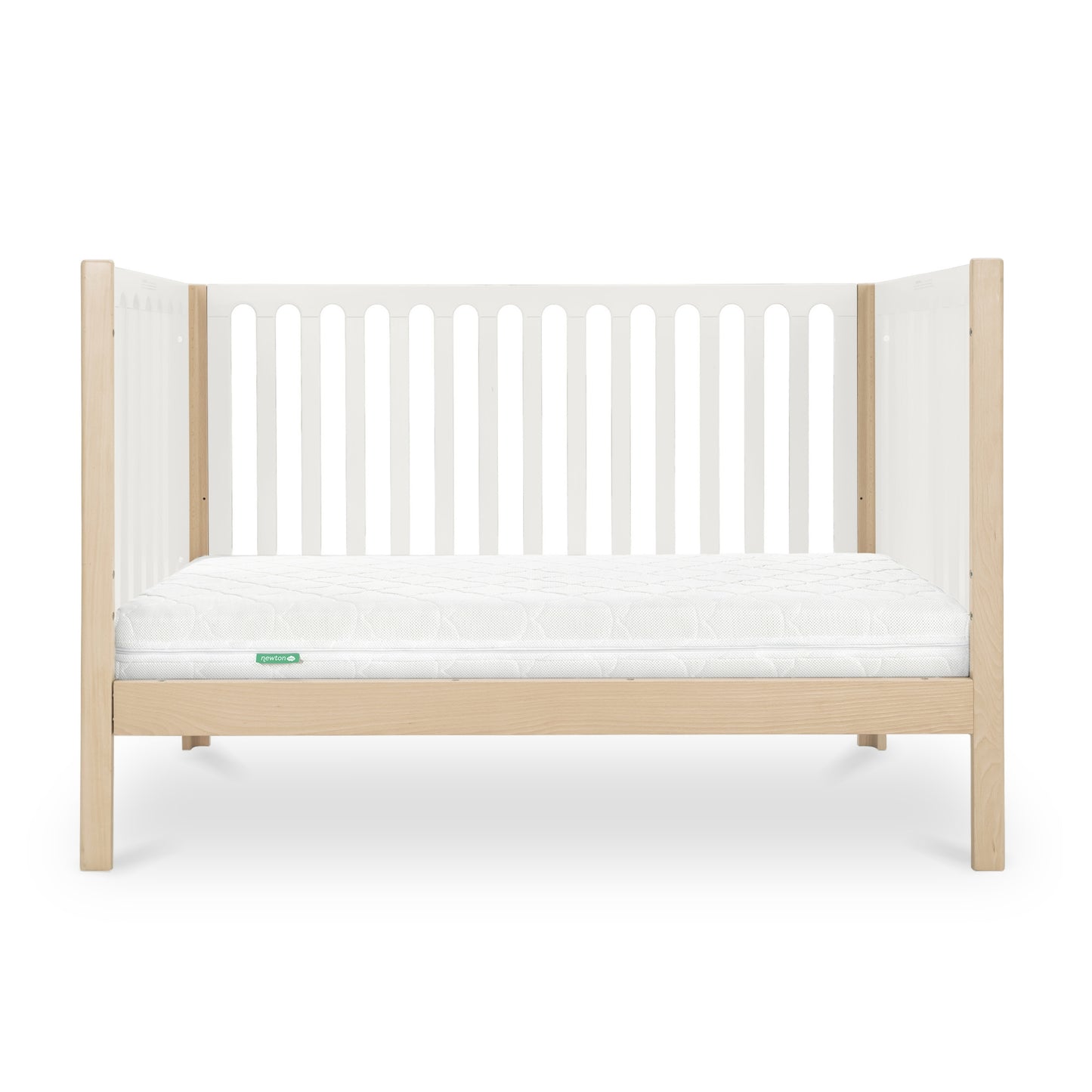 The Newton Galileo Convertible Crib by Newton Baby features a modern beech wood frame with light wood legs, white slatted sides, and a white mattress. Shown from the front on a white background. Converts to a toddler bed for added versatility.