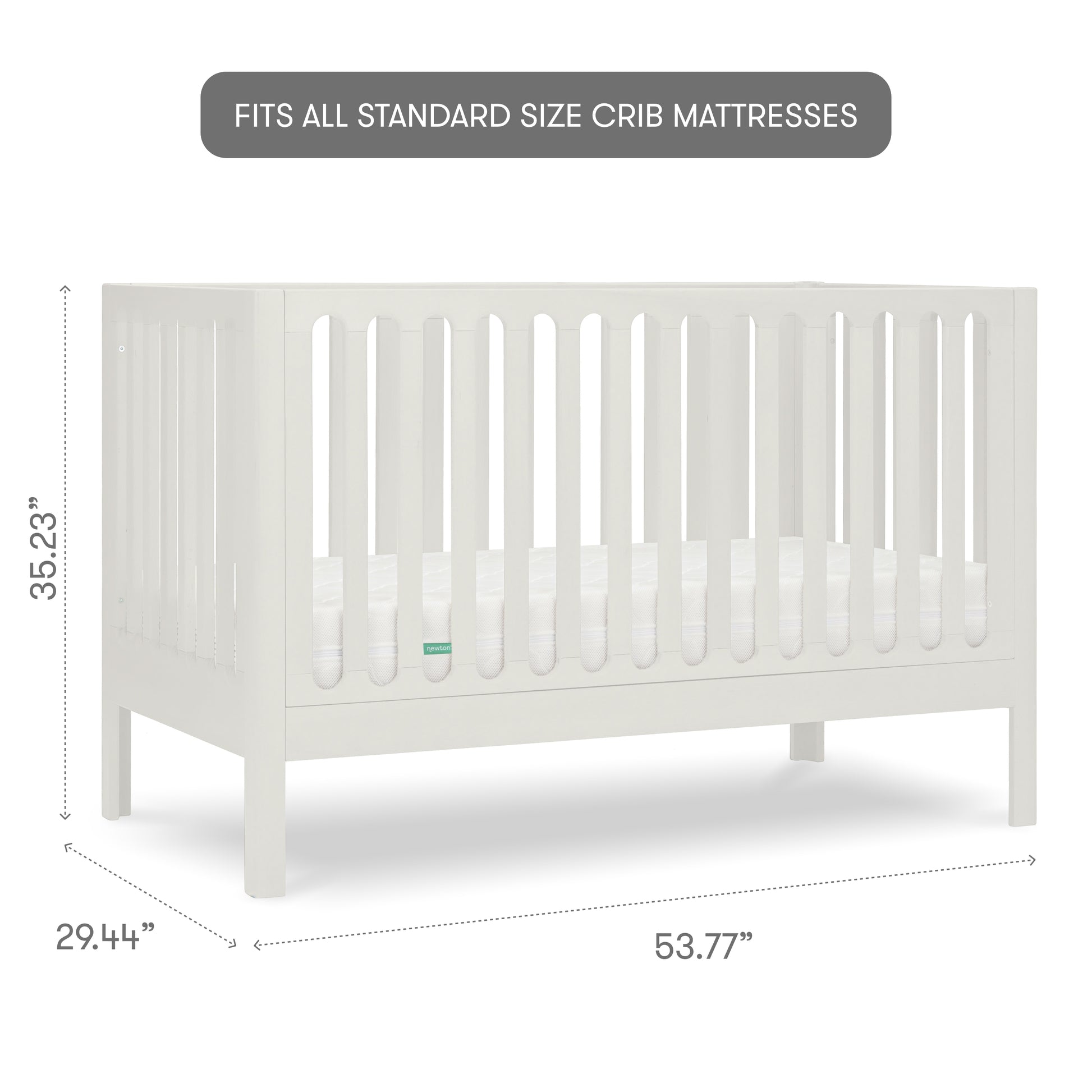 White baby crib with slatted sides and a visible mattress, isolated on a gray background with measurements, 35.23 inches tall, 29.44 inches wide, 53.77 inches long, with text "fits all standard size crib mattresses"