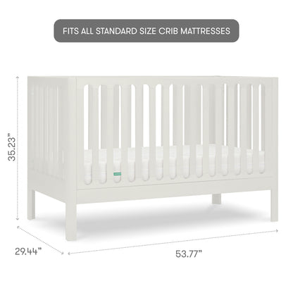 White baby crib with slatted sides and a visible mattress, isolated on a gray background with measurements, 35.23 inches tall, 29.44 inches wide, 53.77 inches long, with text "fits all standard size crib mattresses"