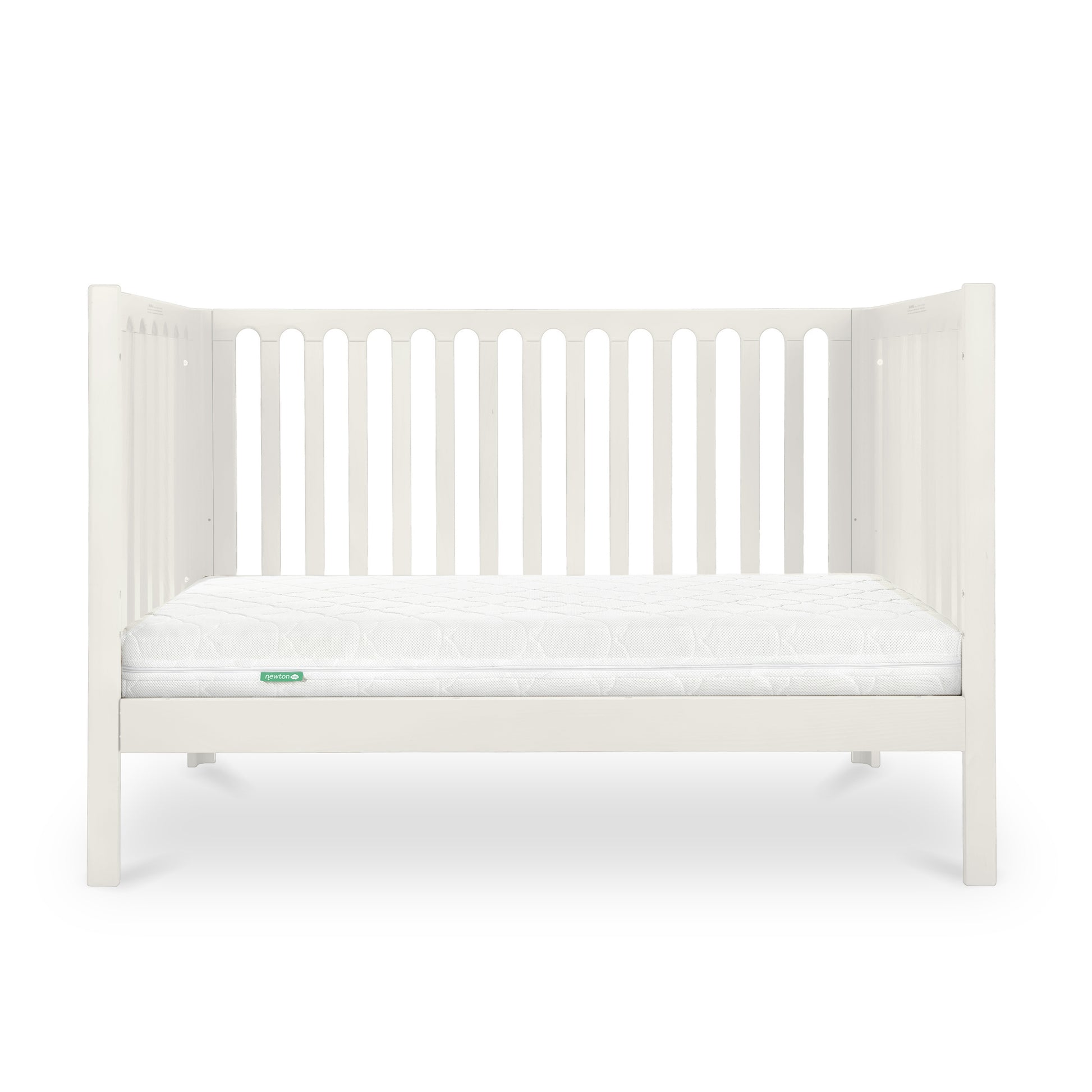 A simple white baby crib with a clean mattress displaying a small green 'Newton' logo on its corner.