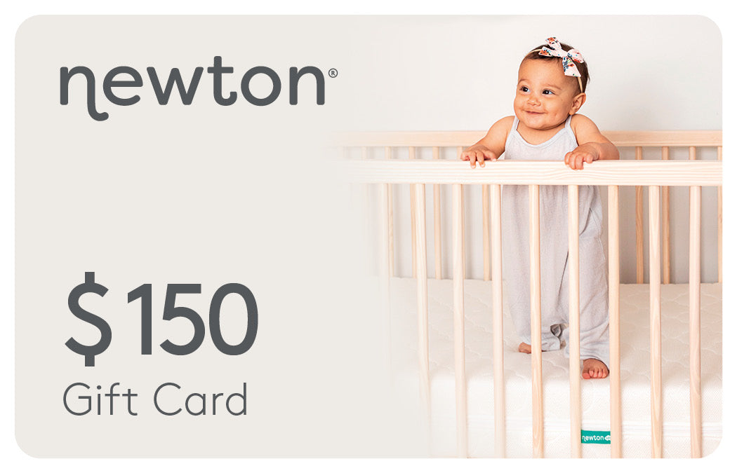 Smiling baby in a crib with a $150 Newton gift card advertisement. GIFT150