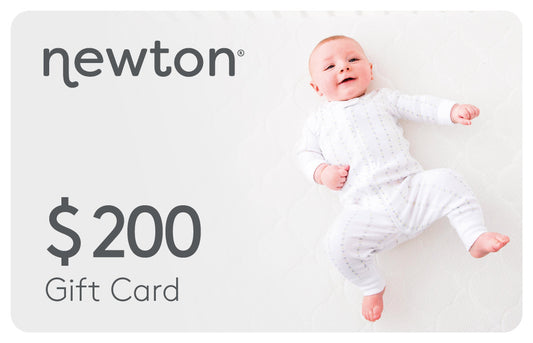 Smiling baby in a white onesie next to a "Newton $200 Gift Card" promotion. GIFT200