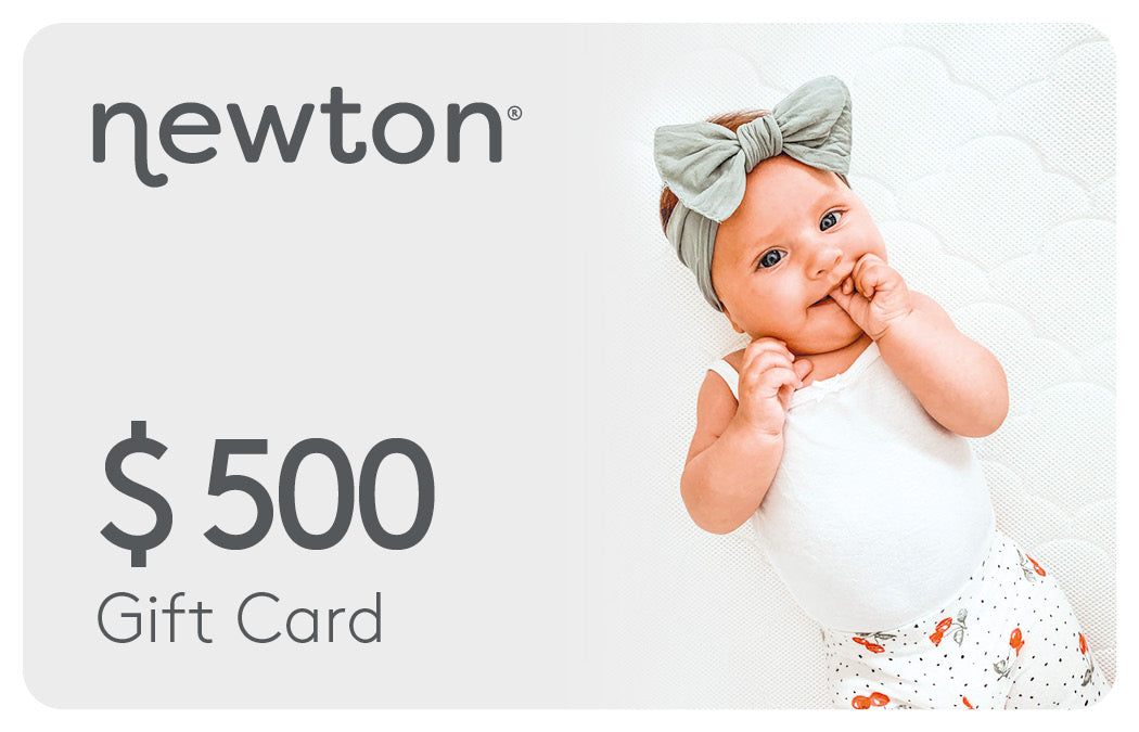 Smiling baby wearing a bow headband featured on a promotional image for a "$500 Newton Gift Card." GIFT500