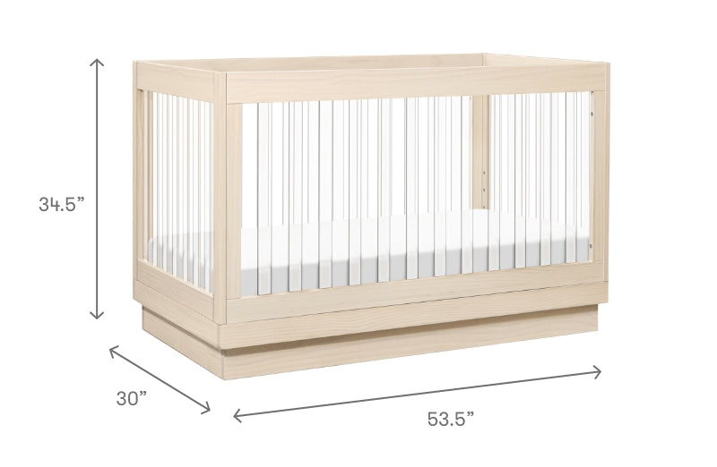 A light wood baby crib with dimensions labeled as 34.5" in height, 30" in width, and 53.5" in length.