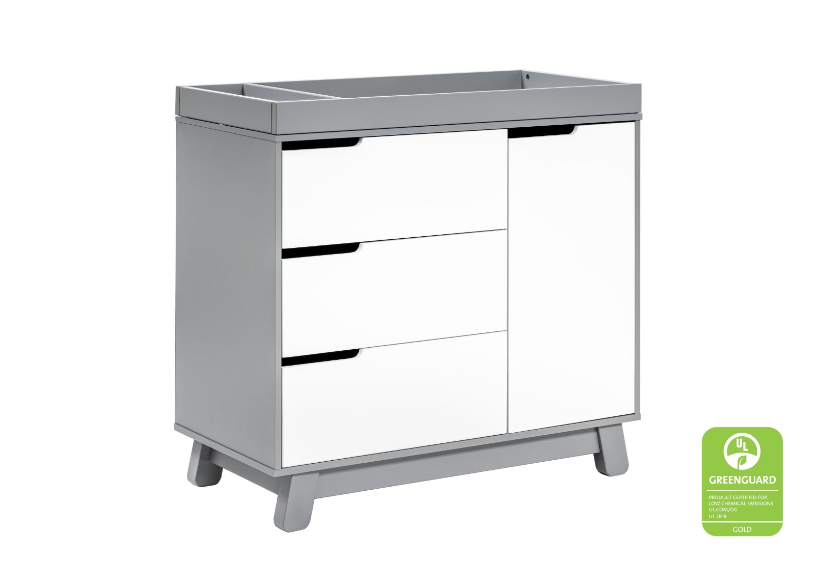 Modern white baby changing table with three drawers and a cabinet, featuring a "GREENGUARD Gold Certified" seal on the lower right.