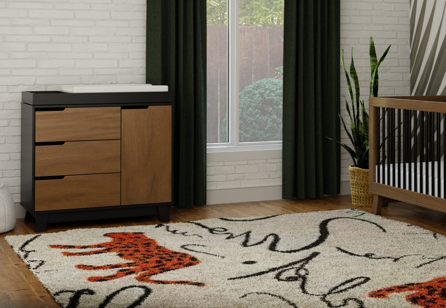 A stylish nursery room featuring a modern crib and changing table, decorated with a vibrant area rug and green curtains, showcasing a cozy and functional design.