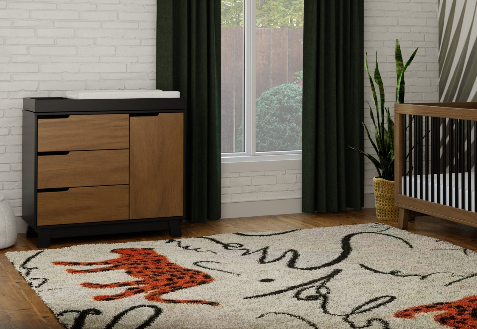 A stylish nursery room featuring a modern crib and changing table, decorated with a vibrant area rug and green curtains, showcasing a cozy and functional design.