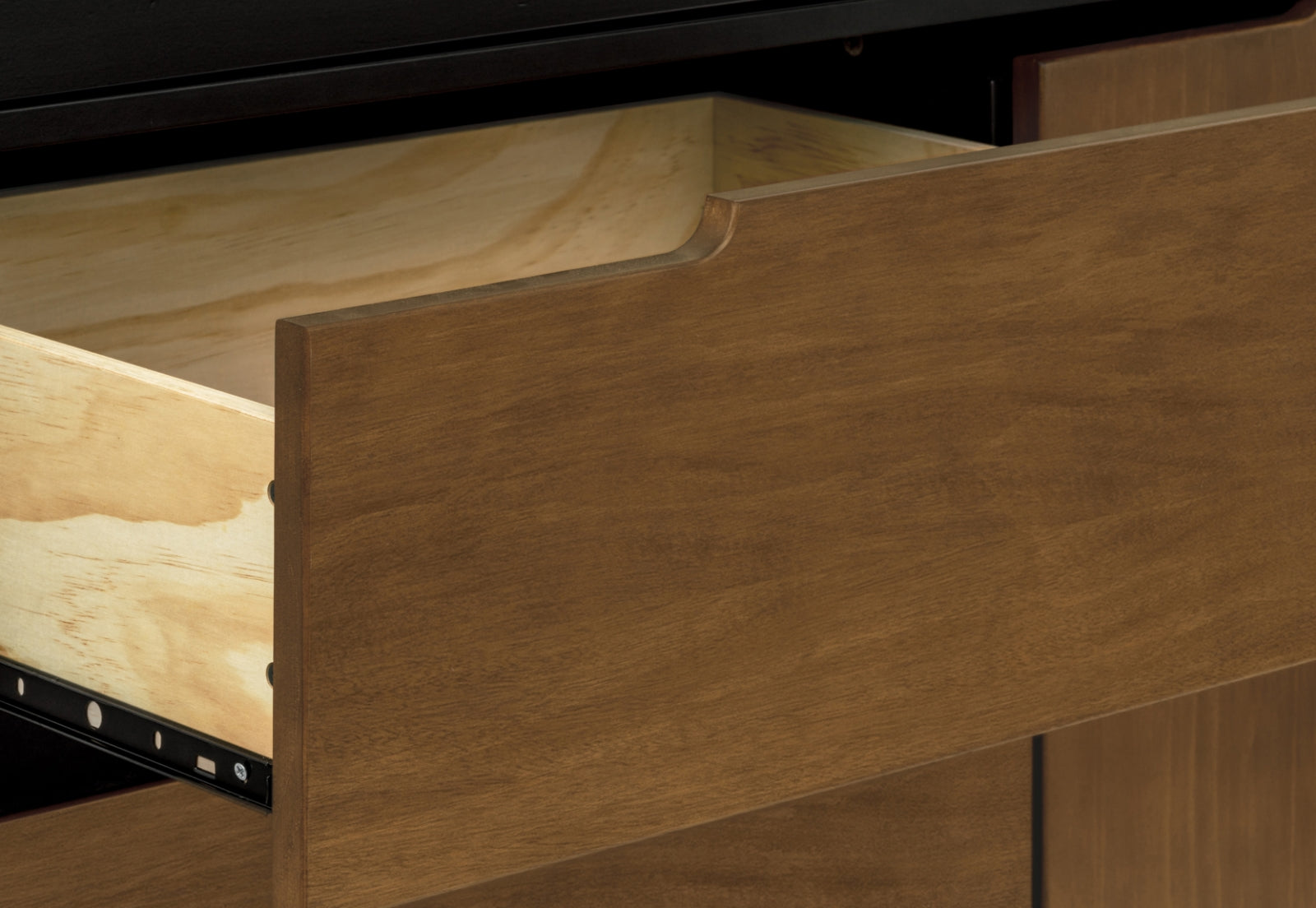 Close-up view of an open wooden drawer showing its quality craftsmanship and smooth finish.