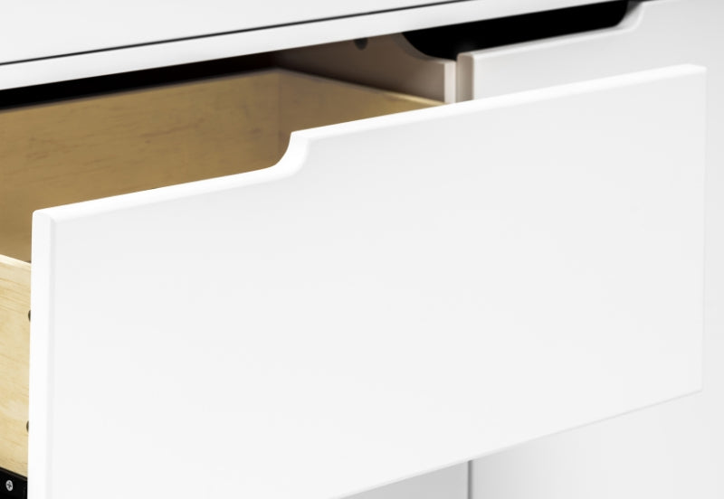 Close-up image of a white drawer partially open, showing a glimpse of the wooden interior.
