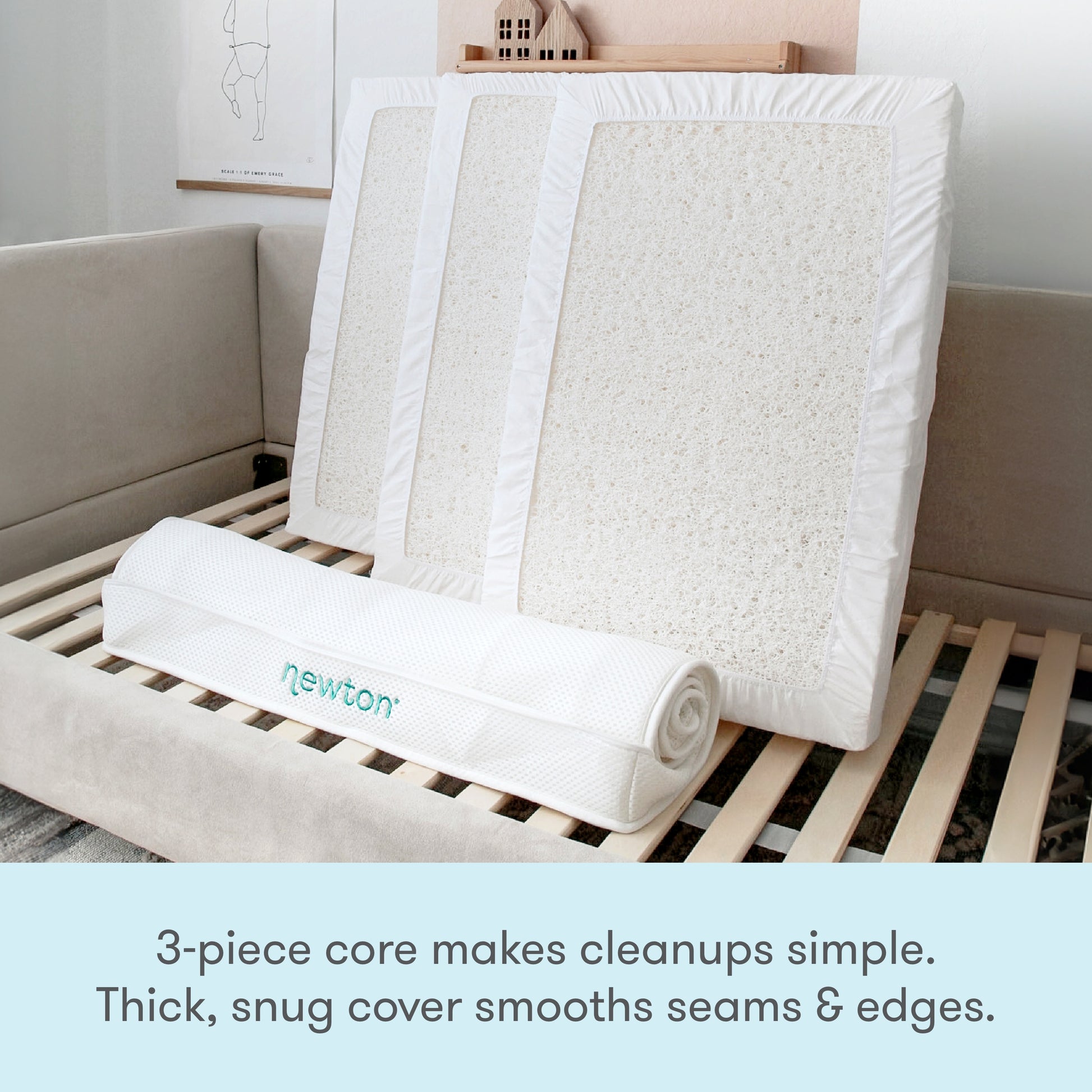 The Newton Baby Kids' Twin Mattress is shown with its 3-piece washable core and a rolled cover on a bed frame. GREENGUARD Gold certified, the textured white core and thick, snug cover make cleanups easy and edges smooth.