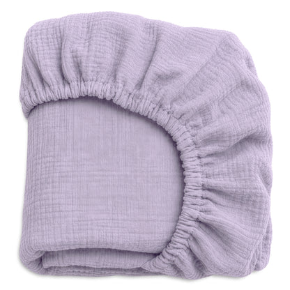 The Newton Baby Breathable, Organic Cotton Sheets (2-pack) feature fitted, lilac sheets with elastic edges and soft, textured fabric—perfect as breathable crib sheets for your baby's comfort.