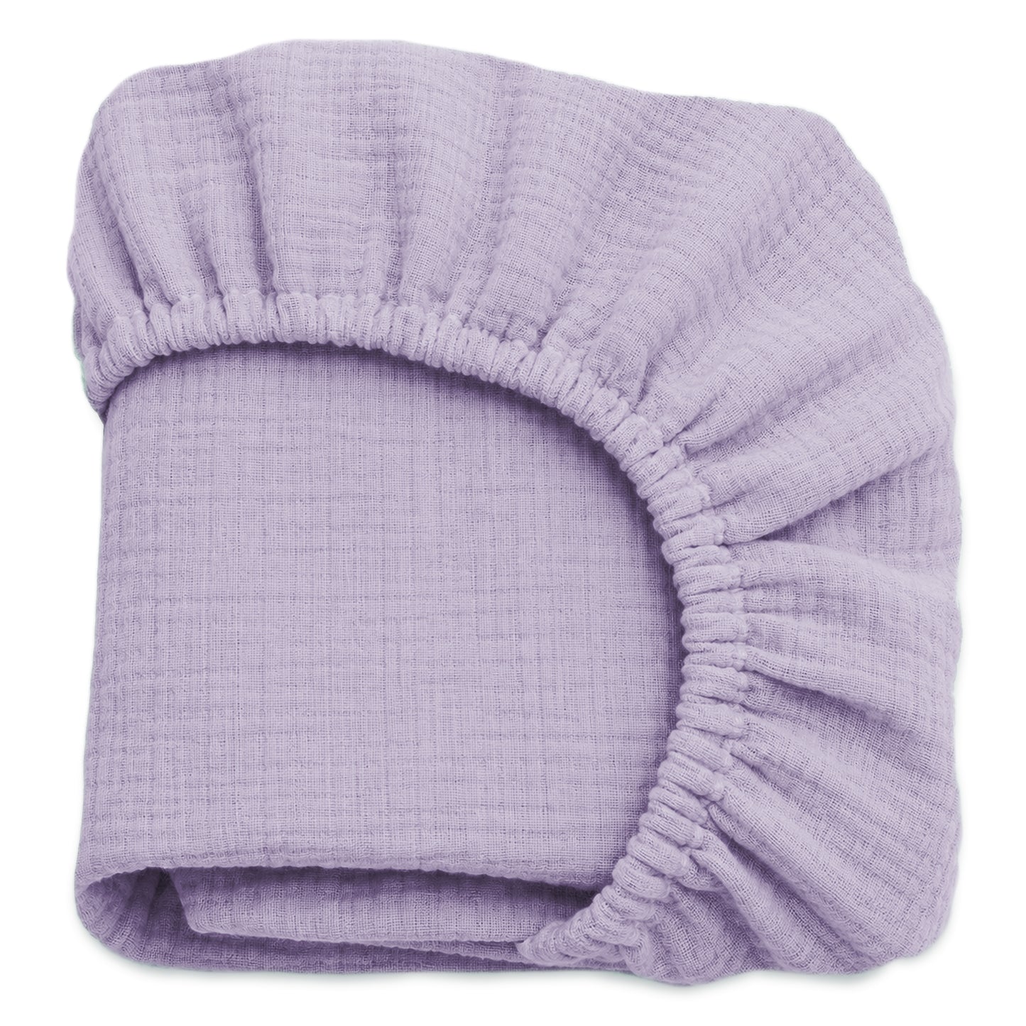 A neatly folded lavender sheet from Newton Baby’s Breathable, Organic Cotton Sheets (2-pack) set, featuring gathered elastic edges and soft muslin cotton, displayed against a white background. 999-3020-LAV