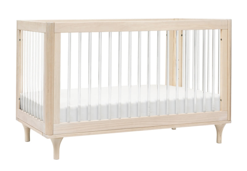 Elegant wooden baby crib with slender vertical bars and gently curved legs on a white background.