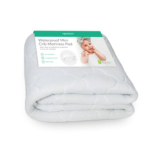 newton waterproof mini crib mattress pad folded on white background